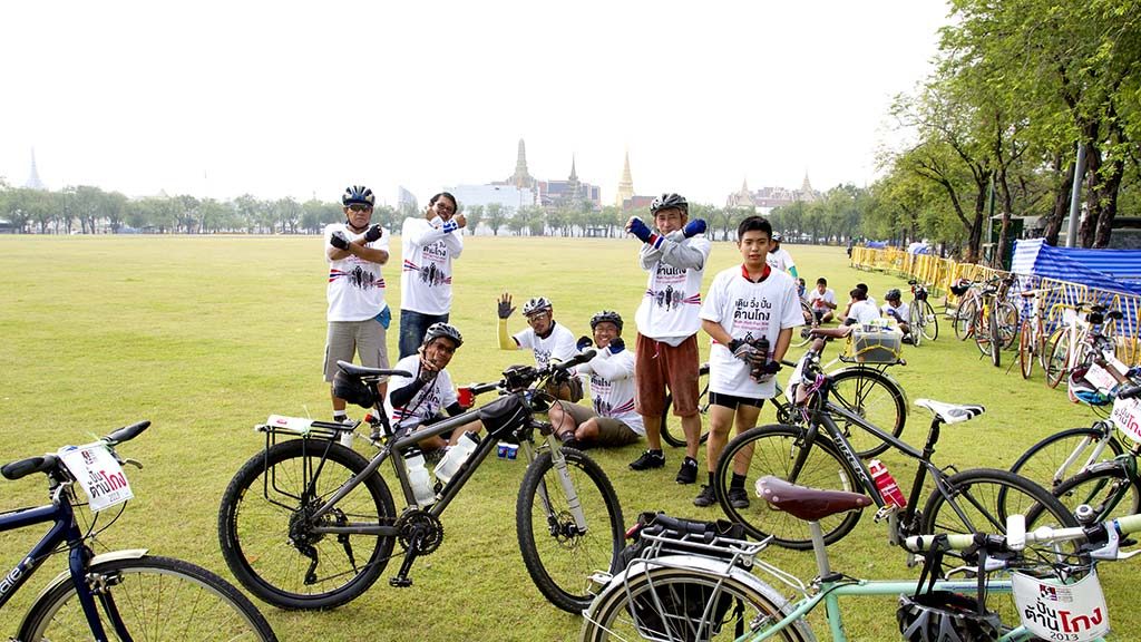 Cyclists on the esplanade of Sanam Luang, Bangkok.