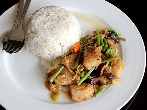 Crispy stir-fried fish with celery leaves with rice.