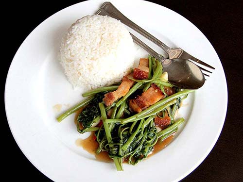 Thai stir-fried morning glory with bacon.