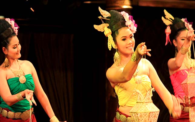Girls dancing traditional Thai dance.